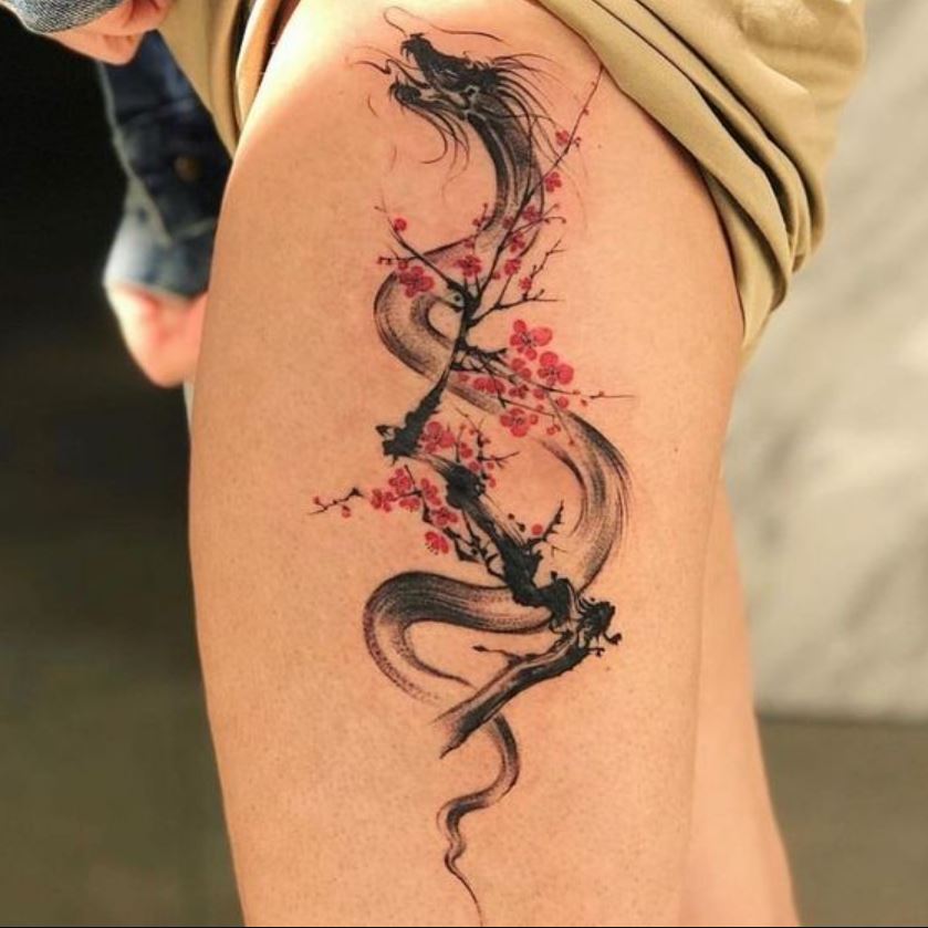 Tatouage Cerisier Japonais Et Dragon Sur La Cuisse 