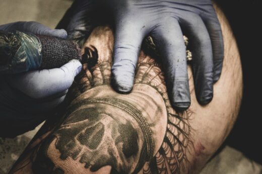 A Person With A Tattoo On Their Arm