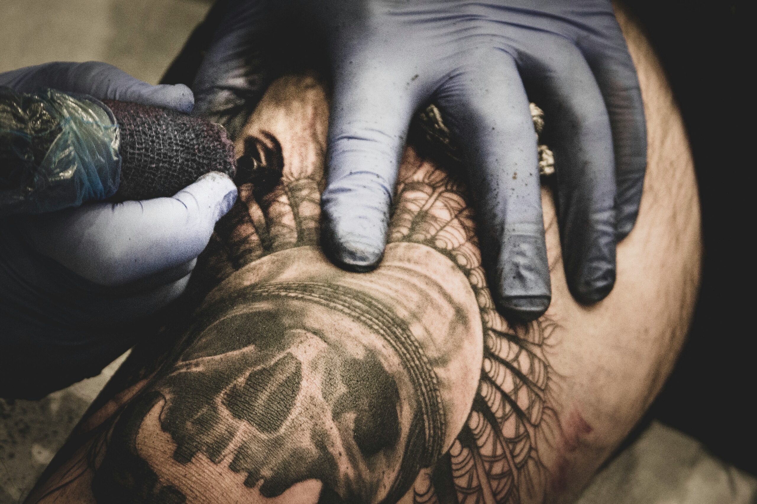 A Person With A Tattoo On Their Arm